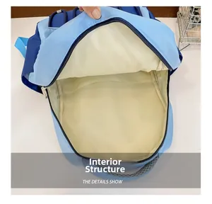 Detailed interior of contrast color kids backpack showing spacious main compartment