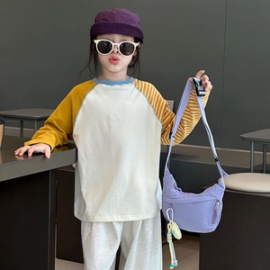 Simple light purple nylon half-moon crossbody bag for kids with adjustable strap and cute charm