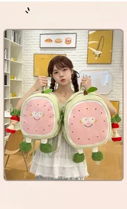 Close-up of cute cartoon fruit backpacks with 3D limbs held by a model in a cozy room