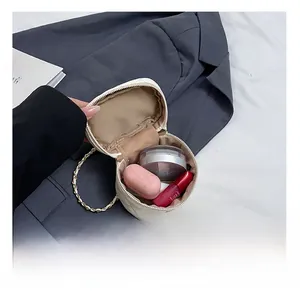 Internal view of white quilted mini bag showing storage capacity for cosmetics