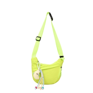 Minimalist neon green crescent nylon crossbody bag for kids with cute plush moon charm