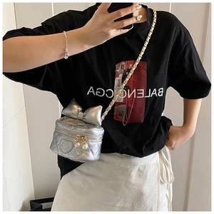 Silver bow-shaped crossbody bag with diamond quilting and cat-motif heart emblem