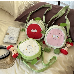 Detailed embroidery and fruit-shaped leaves on canvas fruit-themed crossbody bags