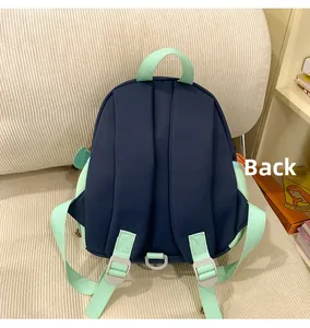 Back view of a lightweight navy and mint green toddler backpack with wide shoulder straps