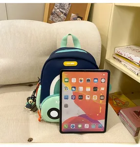 Cartoon kids backpack size comparison with a tablet showing the compact school bag design