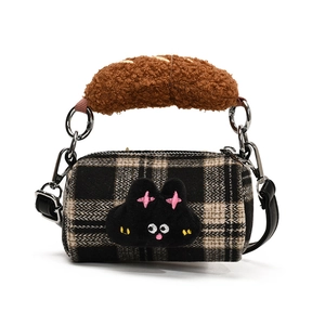 Plaid plush puppy bucket bag with brown faux shearling handle and black leather strap