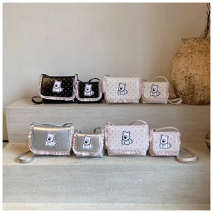 Detailed display of cute puppy crossbody bags in black, white, silver and pink colors