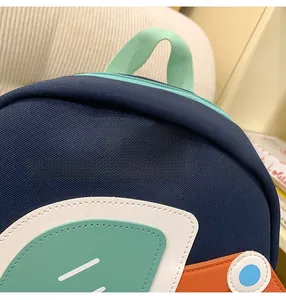 Detail of the NaNa preschool backpack showing durable canvas texture and logo patch