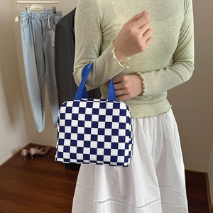 Blue and white checkered lunch bag with sturdy handles for work and travel