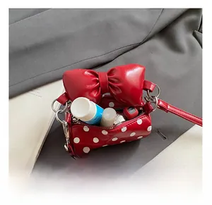 Internal view of the mini polka dot bag showing space for lipstick and essentials