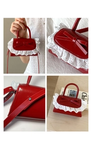 Detail of red shiny mini bag with bow accent and white lace trim shown from multiple angles