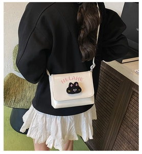 Detailed back view of a white PU leather crossbody bag with a cute plush cat embroidery