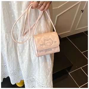 Close-up of pink quilted mini crossbody bag with cat embroidery and Helane lettering