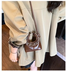 Close-up of brown PU leather crossbody bag with brown plaid ruffled lace trim detail