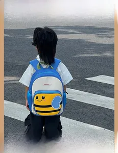 Detailed view of kids cartoon bee backpack with mesh pocket and colorful 3D design