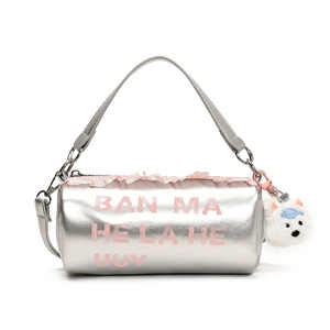 Silver cylinder shoulder bag for kids with pink lace trim and white plush dog charm