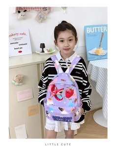 Detailed view of kids purple cartoon backpack with cute shark print on a young girl