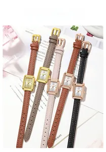 Fünf elegante rechteckige Damen-Quarzuhren mit Lederarmbändern auf einem Modemagazin