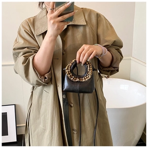 Mini brown retro kids crossbody bag featuring vintage plaid ruffle detail on top handle