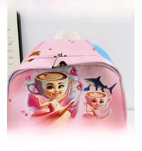 Close-up of pink kid backpack featuring surrealist cartoon art and high-quality prints