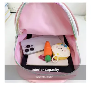 Internal view of the pink rainbow backpack showing spacious compartment for essentials