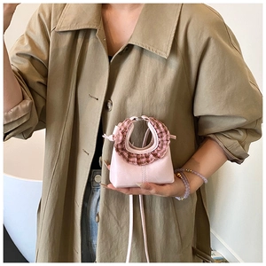 Pink mini PU leather handbag for kids with brown checkered ruffle handle detail