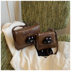 Detailed set of chocolate brown PU leather crossbody bags with plush cat and purple embroidery