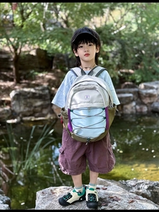 Close-up of the outdoor children's backpack featuring waterproof nylon and bungee cords