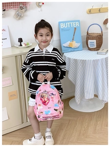 Pink cartoon backpack with CAPPUCCINA girl print being worn by a child in a room