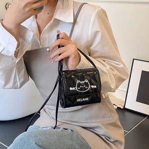 Quilted mini crossbody bag for girls featuring a cute cat embroidery in black glossy finish