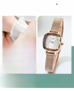 Detail of square rose gold ladies watch with mesh strap and minimalist markers