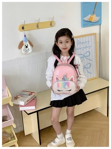 Close-up of pink unicorn backpack with sequin horn and 3D floral accents for girls