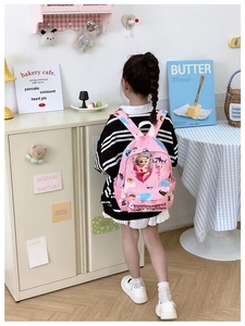 Pink cartoon backpack for children featuring sea animal prints and adjustable white straps