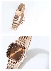 Macro detail of rose gold square watch with milanese mesh band and polished finish