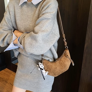 Brown frosted croissant bag for kids with cute puppy charm and adjustable strap