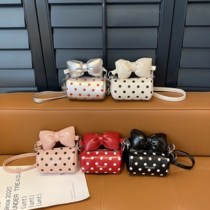 Polka dot mini crossbody bags with bow accent in five colors: silver, white, pink, red, black