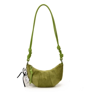 Matte green croissant crescent bag for kids with dog pendant and knotted shoulder strap