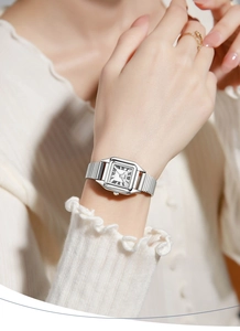 Close-up of GEDI women's quartz watch with silver square dial and woven mesh strap