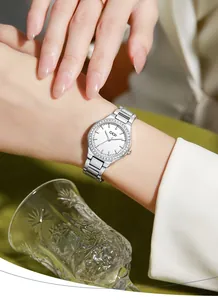 Close-up of GEDI silver women's watch with rhinestone bezel and steel link bracelet