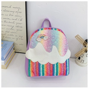 Detail view of purple kids backpack with rainbow sequins and embroidered cloud patches