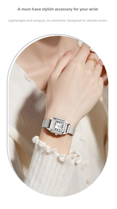 Detail of silver rectangular women watch with Roman numerals and mesh steel strap