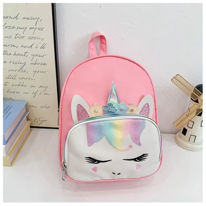 Detail view of cartoon unicorn backpack with sequins and floral embroidery for kids