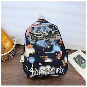 Close-up of durable black backpack with surrealist cartoon prints and BOMBARDIRO logo