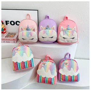 Close-up of cute cartoon PU backpacks for kids with unicorn and rainbow sequin designs