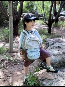 Close-up of children's outdoor backpack with color-blocking and bungee cord system