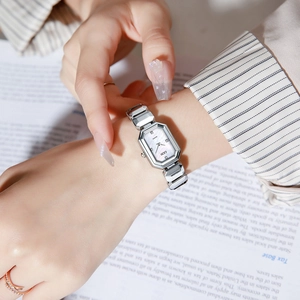 GEDI Women's silver quartz watch with octagonal dial and pearl texture on the wrist