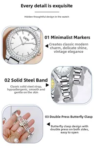 Detail of steel strap, butterfly clasp and rhinestone bezel on a women watch