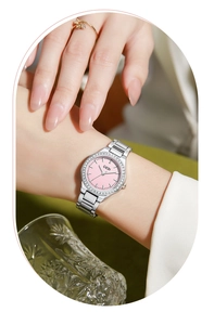 Detailed close-up of a silver GEDI steel watch featuring a pink rhinestone-encrusted dial