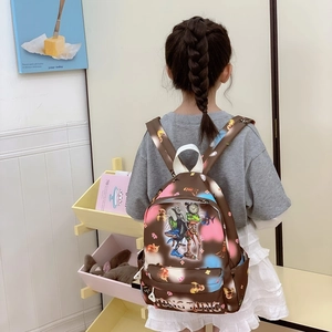 Cartoon printed kids backpack with surreal animal illustrations for primary school