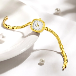 Montre-bracelet à quartz dorée pour femme avec bracelet texturé et cadran serti de strass